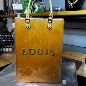Louis Vuitton tote shopping Bag with pvc cover.